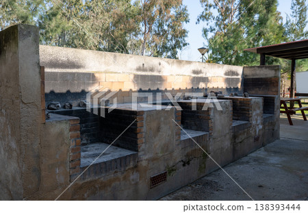 Outdoor barbecue grill station with brick fire pits in campsite park rustic cooking area travel and leisure concept Outdoor barbecue grill station with brick fire pits in campsite park rustic cooking area travel and leisure concept 138393444