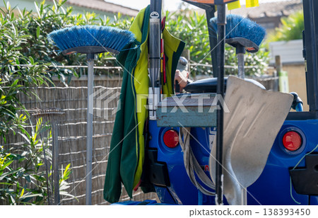 Cleaning equipment tools and brush on utility vehicle in outdoor environment maintenance service and sanitation work concept Cleaning equipment tools and brush on utility vehicle in outdoor environment maintenance service and sanitation work concept 138393450