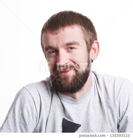Pleasant news. Cheerful man smiling on white isolated background, studio shot, copy space Pleasant news. Cheerful man smiling on white isolated background, studio shot, copy space 138393523