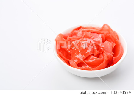 Red marinated ginger in white bowl at white background with copy space, isolated 138393559