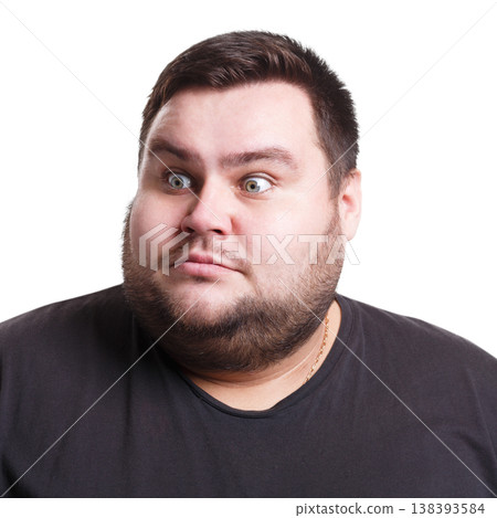 Shocking news. Surprised fat man expressing amaze on face, standing on white isolated background, studio shot Shocking news. Surprised fat man expressing amaze on face, standing on white isolated background, studio shot 138393584