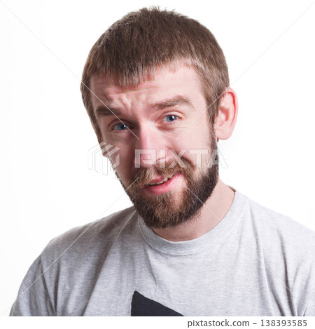 Feeling confused. Frustrated man grimacing to camera on white isolated background, studio shot, portrait 138393585
