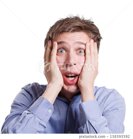 Shocking news. Shocked man emotional, expressing amaze on face, standing on white isolated background, studio shot Shocking news. Shocked man emotional, expressing amaze on face, standing on white isolated background, studio shot 138393592