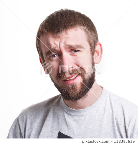 Feeling confused. Frustrated man grimacing to camera on white isolated background, studio shot, portrait 138393639