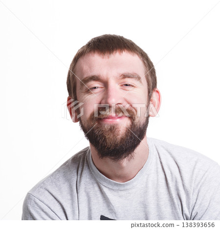 Pleasant news. Cheerful man smiling on white isolated background, studio shot, copy space 138393656