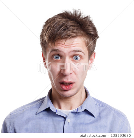 Can't believe it. Surprised man expressing amaze on face, standing on white isolated background, studio shot Can't believe it. Surprised man expressing amaze on face, standing on white isolated background, studio shot 138393680