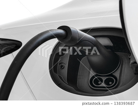 Electric Car Charging Plug Connected to EV Vehicle Battery Port Electric Car Charging Plug Connected to EV Vehicle Battery Port 138393687