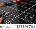 Solar panel connector cable and MC4 plug installation tools on photovoltaic surface 138393708