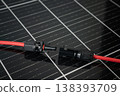 MC4 solar connector cable unplugged on photovoltaic panel close up 138393709