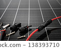Solar panel connector cable and MC4 plug installation tools on photovoltaic surface 138393710