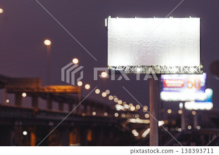Blank billboard mockup on highway at night with bokeh lights 138393711