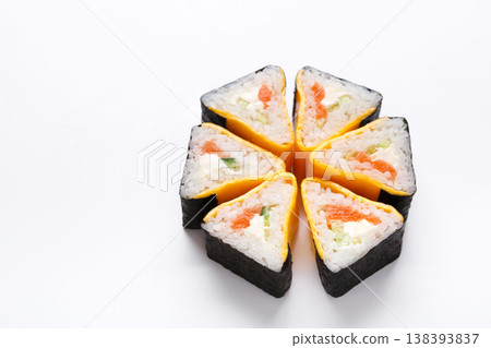 Triangle roll, japanese restaurant delivery. Set on white background with copy space, closeup, pov Triangle roll, japanese restaurant delivery. Set on white background with copy space, closeup, pov 138393837