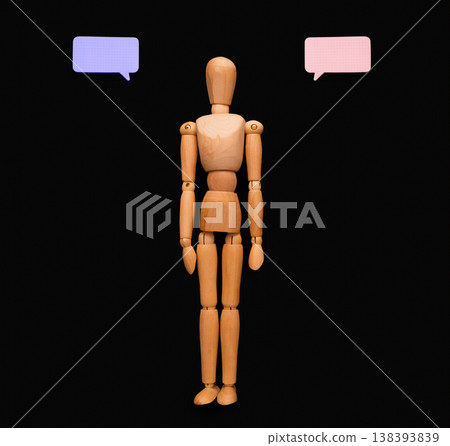 Handcrafted wooden man figure mannequin model dummy doll pointing on blank speech bubble, presenting creative idea or business solution on black studio background, copy space, objects, nobody 138393839