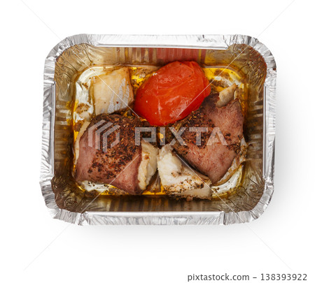 Healthy lunch in foil container. Healthy food take away and delivery. Meat, rice and tomato in box on white background, closeup, isolated Healthy lunch in foil container. Healthy food take away and delivery. Meat, rice and tomato in box on white background, closeup, isolated 138393922