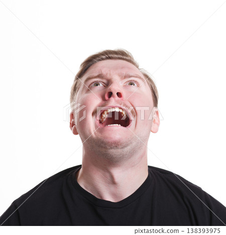 Facial negative expressions. Shouting desperate man looking up, isolated on white background Facial negative expressions. Shouting desperate man looking up, isolated on white background 138393975