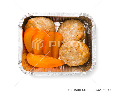 Healthy food restaurant delivery and diet concept. Take away meal in foil box. Meatballs with persimmon 138394058
