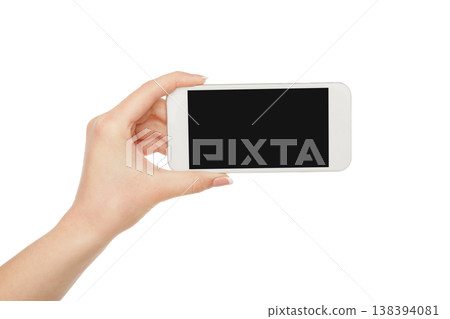 Woman hand holding mobile phone isolated on white background, close-up, cutout, copy space on the screen 138394081