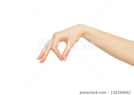 Female hand picking up some items isolated on white background, cutout, close up, copy space 138394082