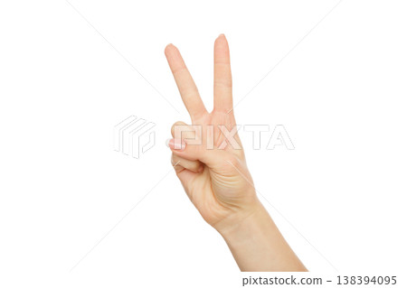 Woman's hand shows number two isolated on white background. Counting gesturing, enumeration, close-up, cutout, copy space 138394095