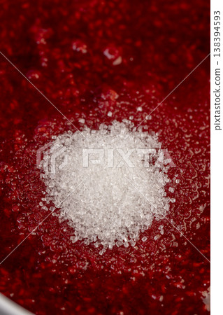 white sugar and juicy red fresh grated strawberries in a bowl, making a sweet, delicious and juicy dessert from natural berries, a large bowl with grated ripe strawberries while cooking jam white sugar and juicy red fresh grated strawberries in a bowl, making a sweet, delicious and juicy dessert from natural berries, a large bowl with grated ripe strawberries while cooking jam 138394593