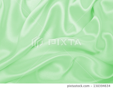 Smooth elegant green silk or satin luxury cloth texture as abstract background. Luxurious background design 138394634