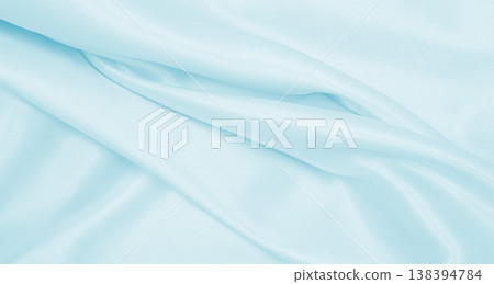 Smooth elegant blue silk or satin luxury cloth texture as abstract background. Luxurious background design Smooth elegant blue silk or satin luxury cloth texture as abstract background. Luxurious background design 138394784