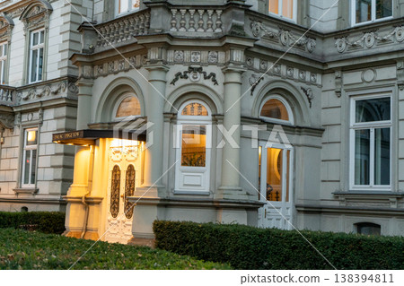Puget Palace in Krakow Poland old house facade architecture. Wall windows. Entrance door Puget Palace in Krakow Poland old house facade architecture. Wall windows. Entrance door 138394811