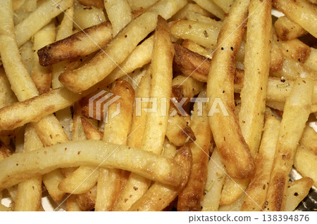 Close up of golden french fries chips fried potatoes tasty junk food 138394876