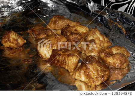 Close up of batterd deep fried golden chicken on foil Close up of batterd deep fried golden chicken on foil 138394878