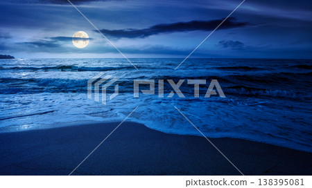 sandy sea beach background on cold summer night. low angle view. full moon over empty seascape scenery with calm waves. beauty seashore wallpaper. mysterious bay photo for advertising sandy sea beach background on cold summer night. low angle view. full moon over empty seascape scenery with calm waves. beauty seashore wallpaper. mysterious bay photo for advertising 138395081