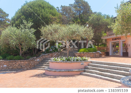 Quiet Mediterranean courtyard with stone steps and greenery. Travel, lifestyle and southern architecture concept Quiet Mediterranean courtyard with stone steps and greenery. Travel, lifestyle and southern architecture concept 138395539
