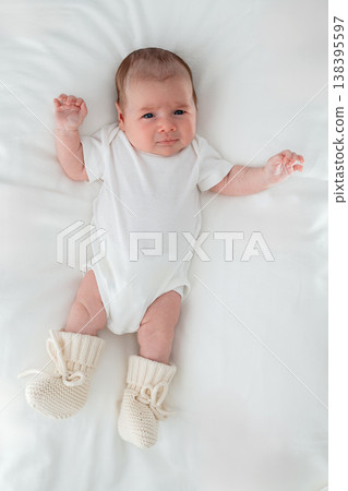 Newborn baby resting on clean surface. Concept of hygiene, newborn health and safe sleeping environment. Newborn baby resting on clean surface. Concept of hygiene, newborn health and safe sleeping environment. 138395597
