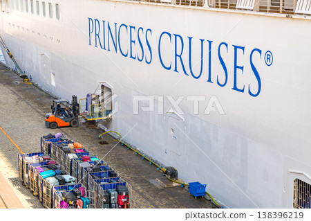 Loading operations onto a luxury cruise ship: Pre-departure preparations involving transporting cargo with forklifts. Loading operations onto a luxury cruise ship: Pre-departure preparations involving transporting cargo with forklifts. 138396219