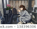 一位女子在墳墓前祈禱。 138396306