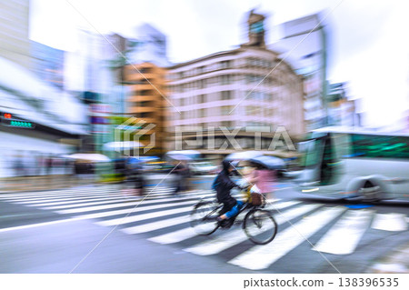 Japan's Tokyo urban landscape blue ticket system starts April 1st. Rainy Ginza and a bicycle... *Panning shot to protect personal information. Japan's Tokyo urban landscape blue ticket system starts April 1st. Rainy Ginza and a bicycle... *Panning shot to protect personal information. 138396535