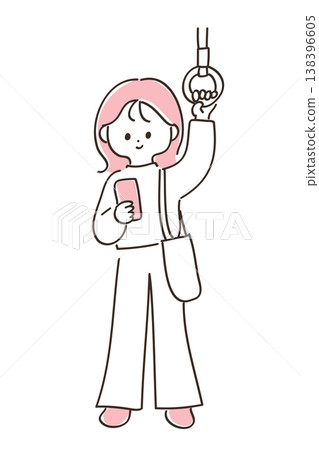 A young woman holding onto a strap on the train and looking at her smartphone. A young woman holding onto a strap on the train and looking at her smartphone. 138396605