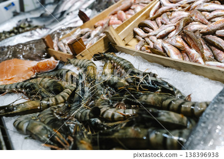 Fresh Shrimp and Fish Displayed on Ice at Seafood Market Fresh Shrimp and Fish Displayed on Ice at Seafood Market 138396938
