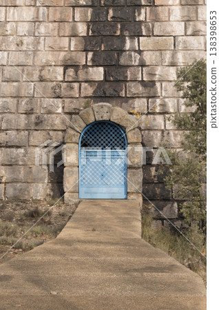 access gates to the interior of the reservoir dam access gates to the interior of the reservoir dam 138398653