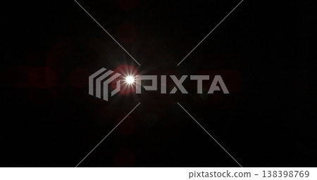 Abstract cinematic lens flare with bright light burst and star rays, isolated on black background. Optical light effect ideal for VFX overlays, transitions, titles and dramatic visual accents. Abstract cinematic lens flare with bright light burst and star rays, isolated on black background. Optical light effect ideal for VFX overlays, transitions, titles and dramatic visual accents. 138398769