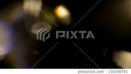 Abstract cinematic lens flare with bright light burst and star rays, isolated on black background. Optical light effect ideal for VFX overlays, transitions, titles and dramatic visual accents. Abstract cinematic lens flare with bright light burst and star rays, isolated on black background. Optical light effect ideal for VFX overlays, transitions, titles and dramatic visual accents. 138398781