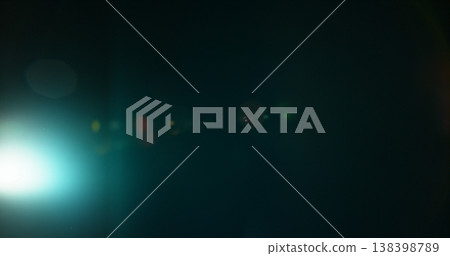 Abstract cinematic lens flare with bright light burst and star rays, isolated on black background. Optical light effect ideal for VFX overlays, transitions, titles and dramatic visual accents. Abstract cinematic lens flare with bright light burst and star rays, isolated on black background. Optical light effect ideal for VFX overlays, transitions, titles and dramatic visual accents. 138398789