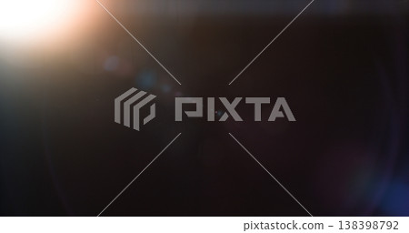 Abstract cinematic lens flare with bright light burst and star rays, isolated on black background. Optical light effect ideal for VFX overlays, transitions, titles and dramatic visual accents. Abstract cinematic lens flare with bright light burst and star rays, isolated on black background. Optical light effect ideal for VFX overlays, transitions, titles and dramatic visual accents. 138398792