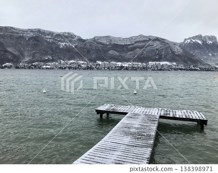 views from the shore of lake annecy after the last snowfall views from the shore of lake annecy after the last snowfall 138398971