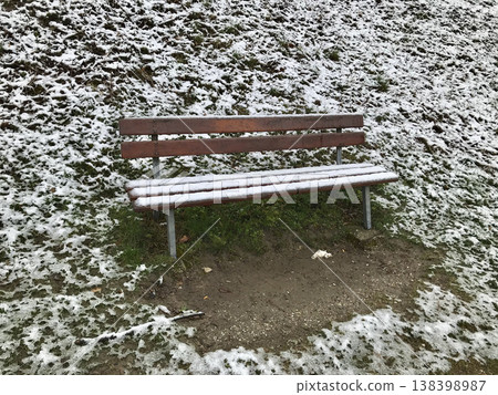 wooden bench covered by snow 138398987
