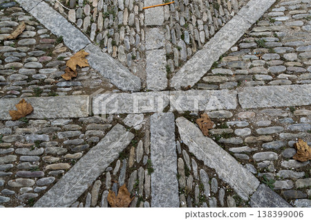 old cobbled street formed with stones of similar size old cobbled street formed with stones of similar size 138399006