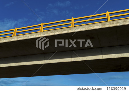 picture of part of the bridge that crosses the highway 138399019