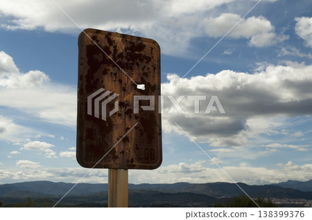 old wooden sign on a mountain road old wooden sign on a mountain road 138399376