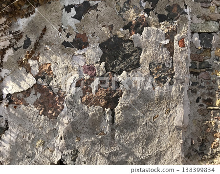 cladding of an old wall deteriorated by weather conditions cladding of an old wall deteriorated by weather conditions 138399834