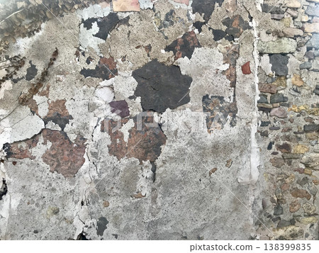 cladding of an old wall deteriorated by weather conditions cladding of an old wall deteriorated by weather conditions 138399835