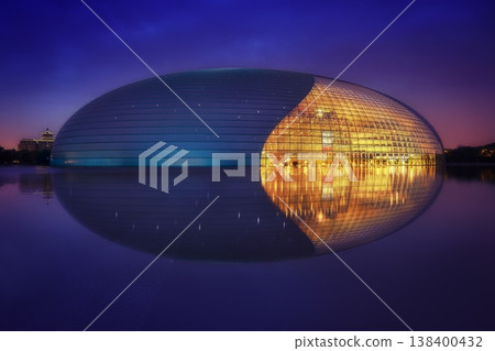 Sunset view of the National Center for the Performing Arts in Beijing with modern architecture reflecting warm evening light. Sunset view of the National Center for the Performing Arts in Beijing with modern architecture reflecting warm evening light. 138400432